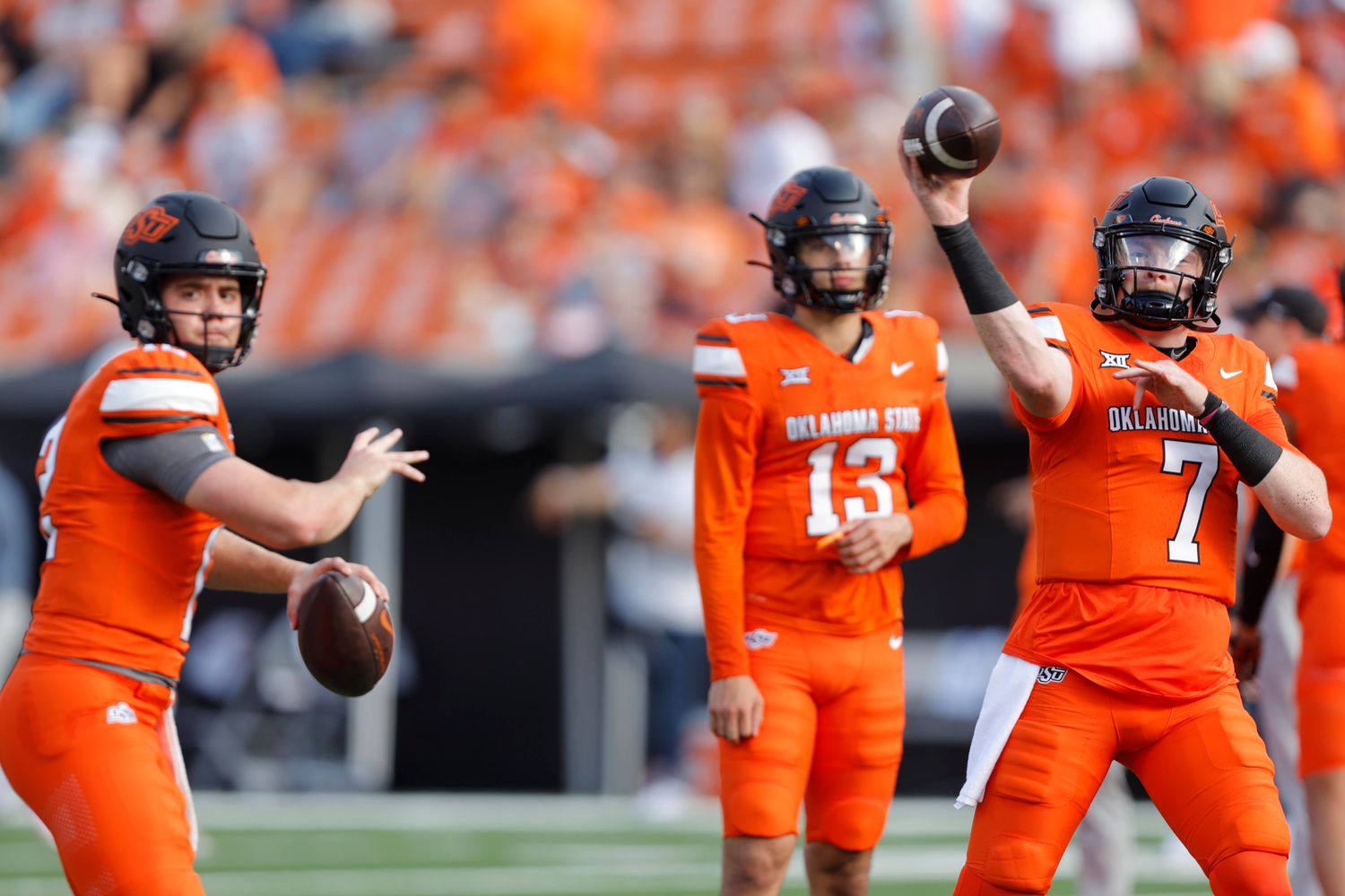 Sep 16, 2023; Stillwater, Oklahoma, USA; Oklahoma State Cowboys quarterback Alan Bowman (7), quarterback Gunnar Gundy (12) and quarterback Garret Rangel (13) warm up before an NCAA football game between Oklahoma State and South Alabama at Boone Pickens Stadium. Mandatory Credit: Bryan Terry-USA TODAY Sports  