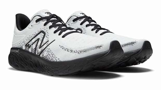 White and black New Balance running shoes.