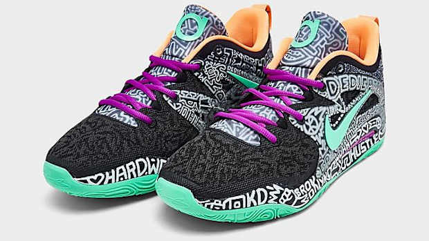 View of black and green Nike KD shoes.