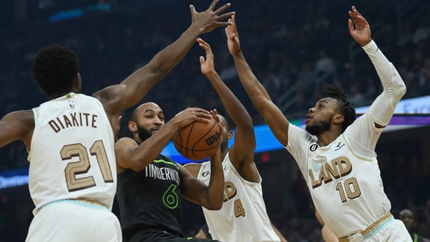 Nov 13, 2022; Cleveland, Ohio, USA; Minnesota Timberwolves guard Jordan McLaughlin (6) drives to the basket against Cleveland Cavaliers forward Mamadi Diakite (21) and forward Evan Mobley (4) and guard Darius Garland (10) during the first half at Rocket Mortgage FieldHouse. Mandatory Credit: Ken Blaze-USA TODAY Sports
