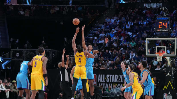Team Pau forward Scottie Barnes (4) goes up for the opening tip against Team Joakim forward Jabari Smith Jr. (1) in the finals of the 2023 NBA All Star Rising Stars Game at Vivint Arena