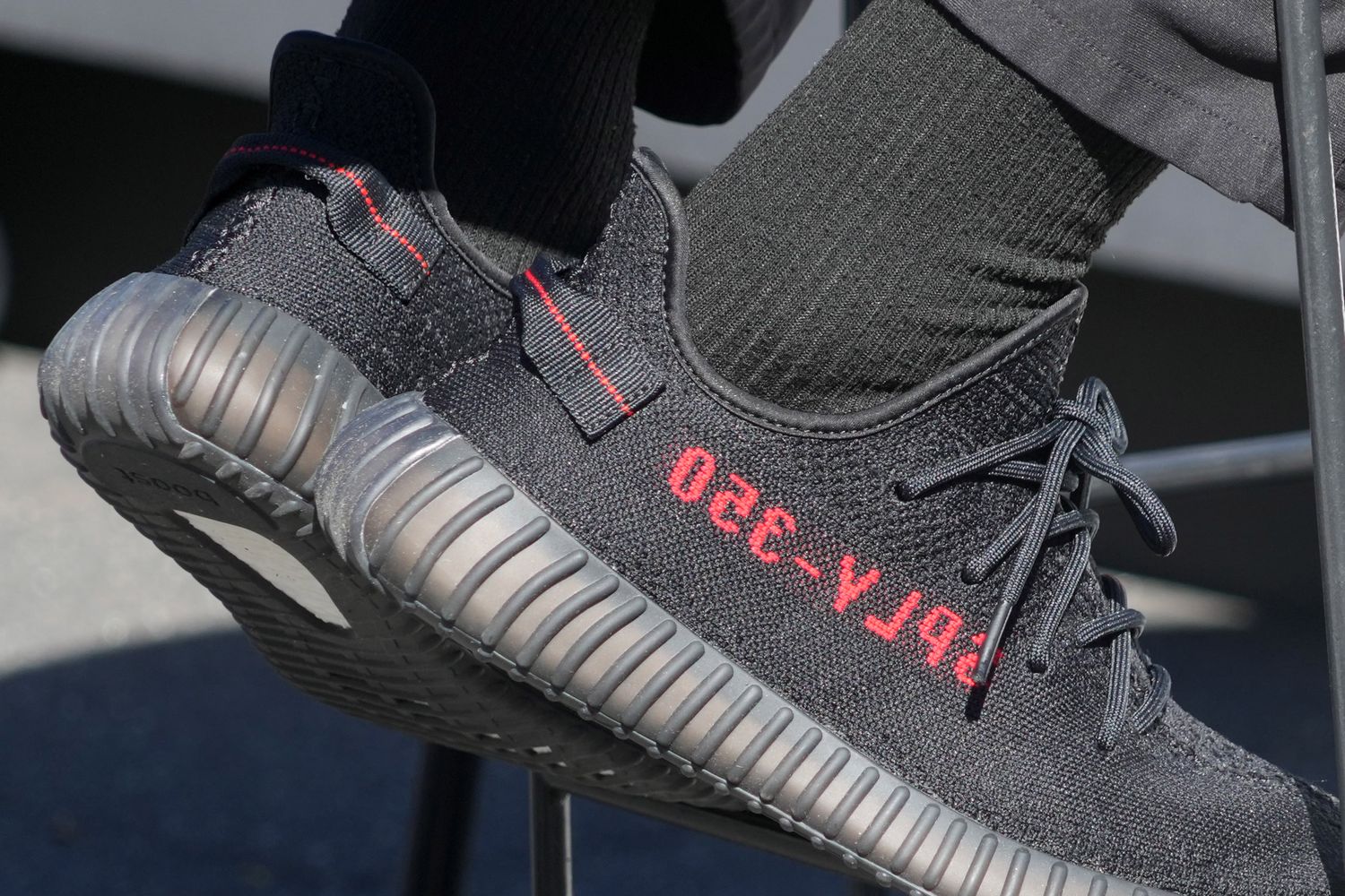 View of black and red adidas Yeezy shoes.