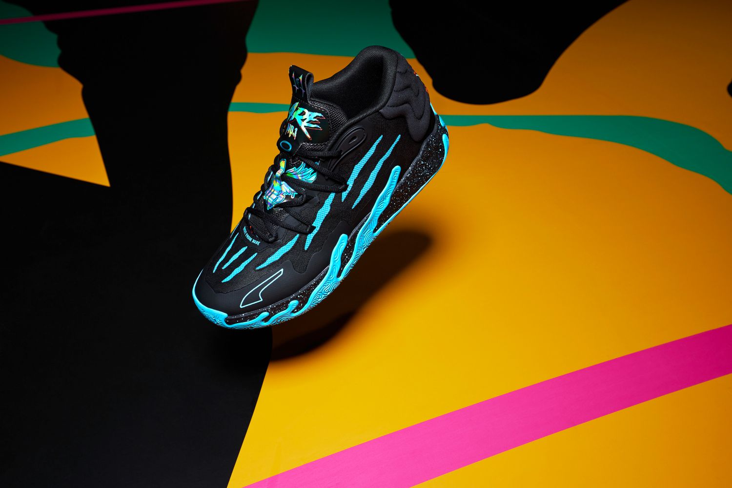 Side view of LaMelo Ball's black and blue PUMA sneakers.