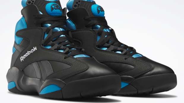 View of black and blue Reebok shoes.