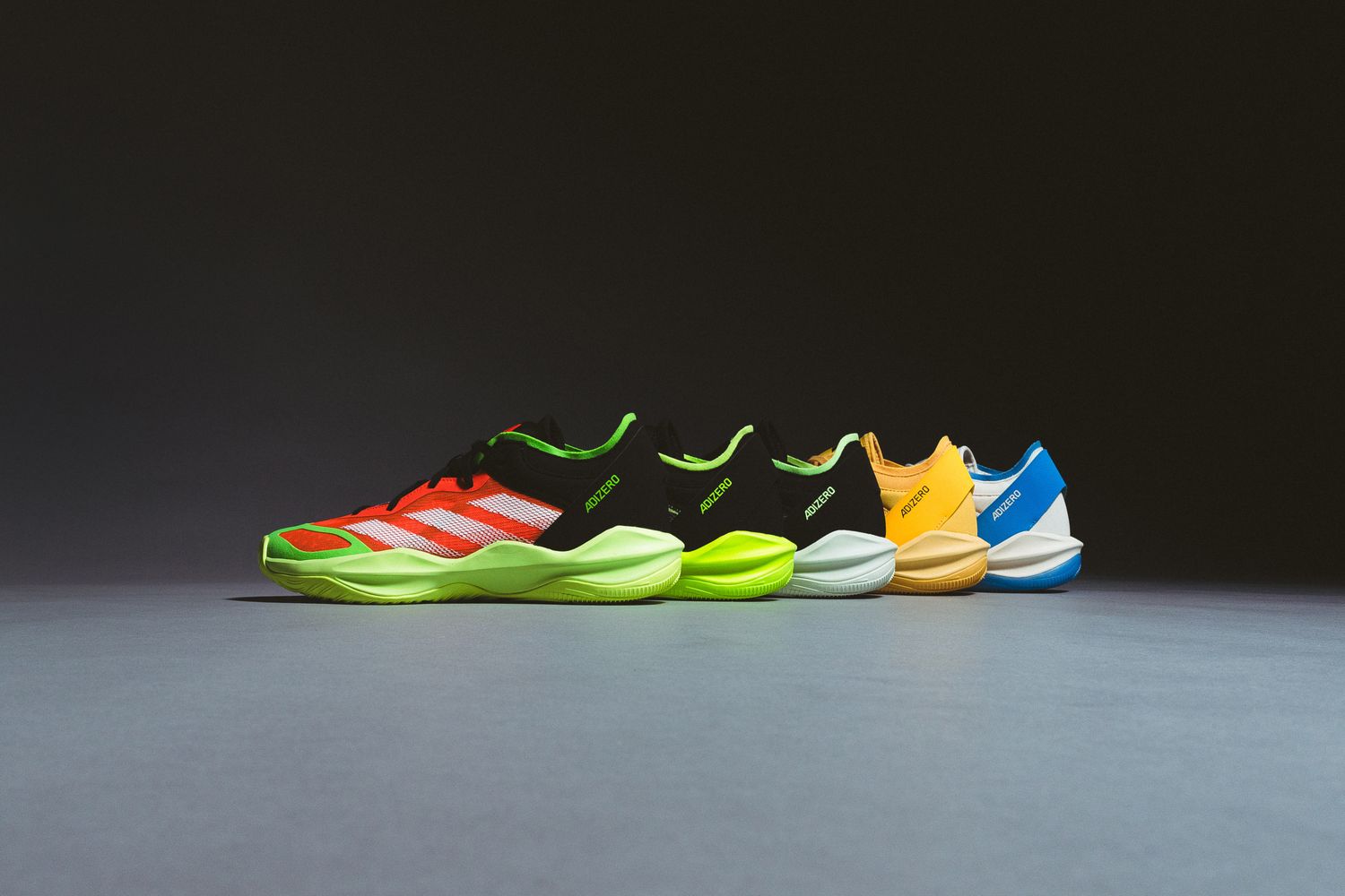 Side view of multicolor adidas basketball sneakers.
