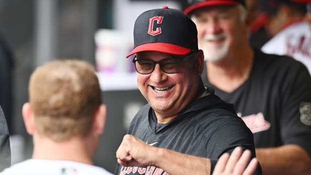 Aug 6, 2023; Cleveland, Ohio, USA; Cleveland Guardians manager Terry Francona celebrates with first baseman Kole Calhoun (56) during the fourth inning at Progressive Field. Mandatory Credit: Ken Blaze-USA TODAY Sports