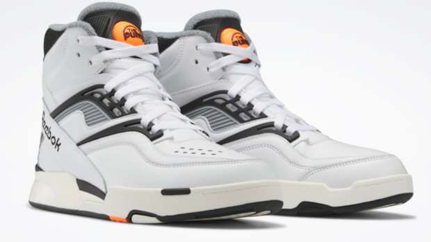 View of white and black Reebok shoes.