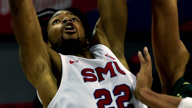 Keon Ambrose-Hylton goes up for a dunk against Charlotte at Moody Coliseum.
