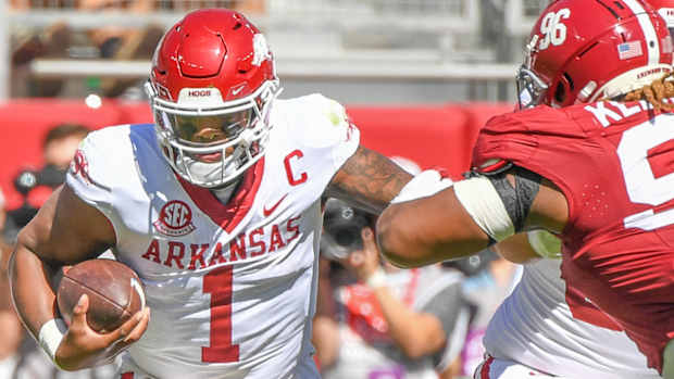 Arkansas quarterback KJ Jefferson tries to break free against Alabama.