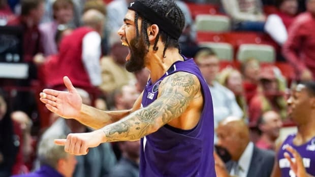 Northwestern Wildcats guard Boo Buie (0) celebrates after defeating the Indiana Hoosiers at Simon Skjodt Assembly Hall.
