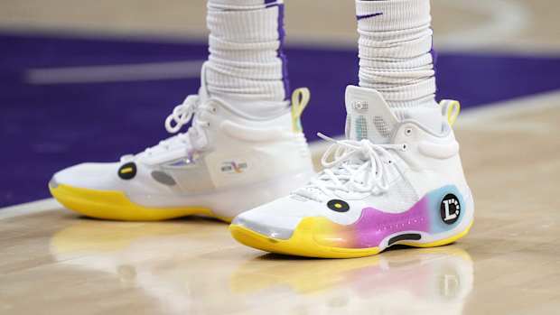 View of D'Angelo Russell's white and yellow shoes.