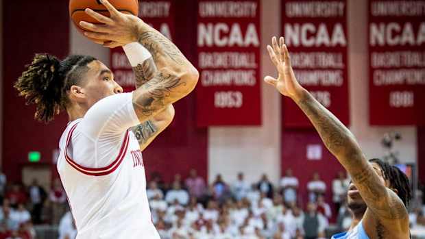 Indiana's Jalen Hood-Schifino (1) scores over North Carolina's Caleb Love (2) during the Indiana versus North Carolina men's basketball game at Simon Skjodt Assembly Hall on Wednesday, Nov. 30, 2022.