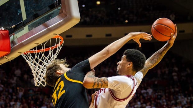 Indiana's Kel'el Ware (1) dunks over Iowa's Owen Freeman (32) as he is fouled during the second half at Simon Skjodt Assembly Hall on Tuesday, Jan. 30, 2024.