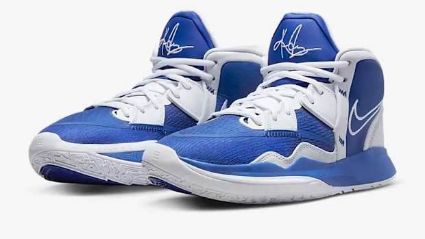 View of blue and white Nike Kyrie shoes.