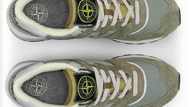 View of grey and white New Balance shoes.