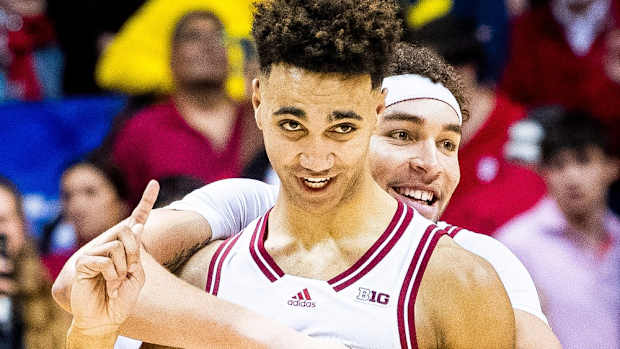 Indiana's Trayce Jackson-Davis (23) and Race Thompson (25) celebrate the victory after overtime of the Indiana versus Michigan men's basketball game at Simon Skjodt Assembly Hall on Sunday, March 5, 2023.