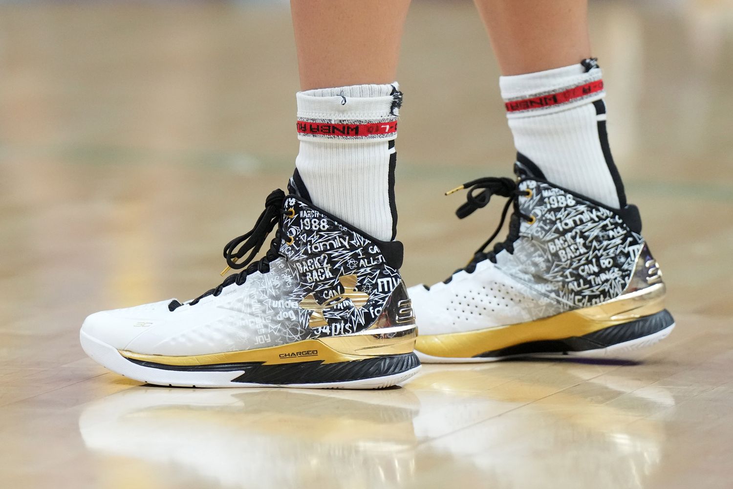 Las Vegas Aces guard Kelsey Plum's white and black Under Armour sneakers.