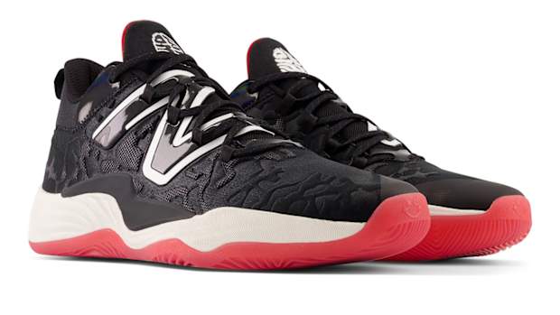 View of black, white, and red New Balance shoes.