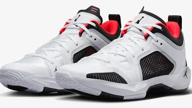 View of white, lack, and red Air Jordan shoes.