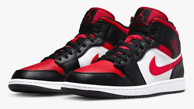 Detailed look at black and red Jordan shoes.