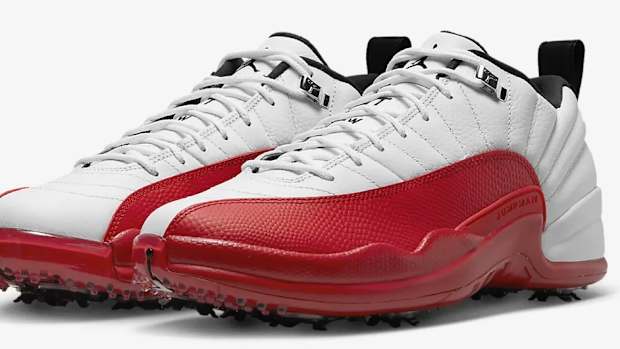 View of white and red Air Jordan shoes.