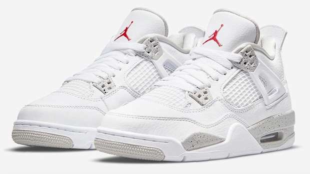 View of white and grey Air Jordan 4 shoes.