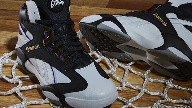 Side view of Shaquille O'Neal's black and white Reebok sneakers.