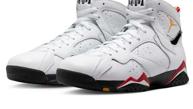 View of white and navy Air Jordan shoes.