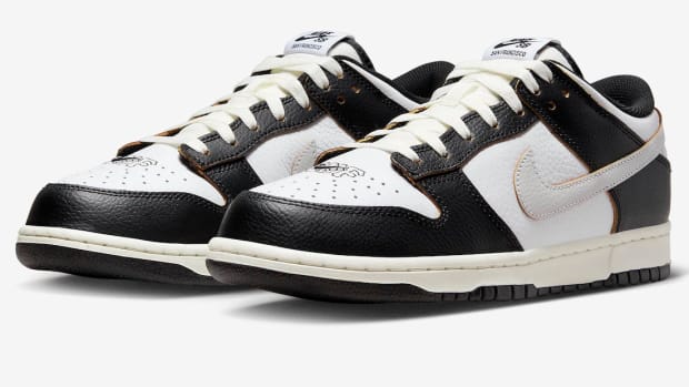 A detailed view of black and white Nike Dunk shoes.