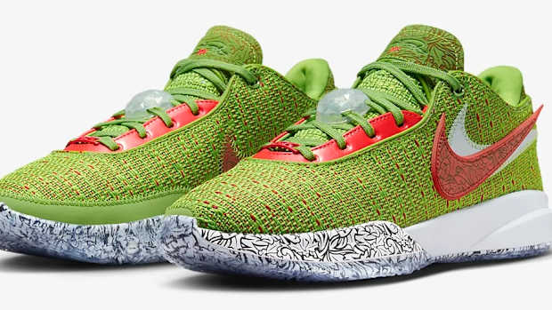 View of green and red Nike LeBron shoes.
