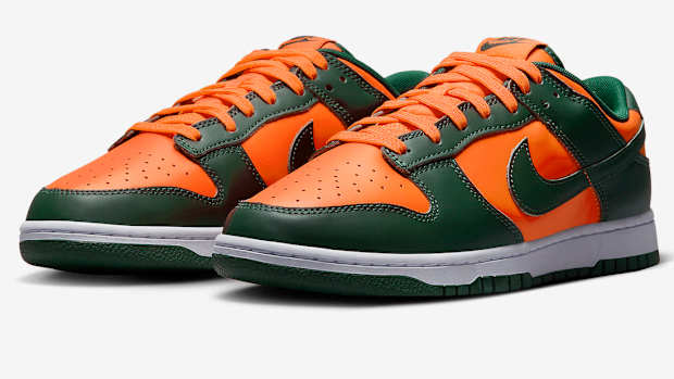 Green and orange Nike Dunk shoes.