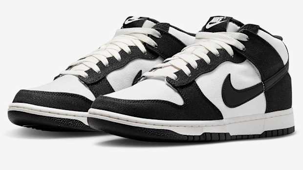 Side view of black and white Nike Dunk shoes.