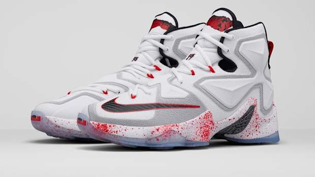 White, red, and black Nike LeBron shoes.