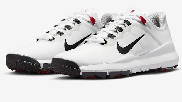 View of white and black Nike golf shoes.
