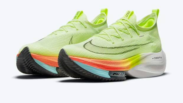 View of lime green Nike running shoes.