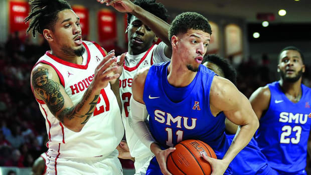 Southern Methodist Mustangs forward Samuell Williamson (11) grabs a rebound during the first half against the Houston Cougars at Fertitta Center.