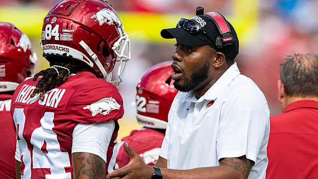 Razorbacks wide receivers coach Kenny Guiton on sidelines with Warren Thompson at Outback Bowl.