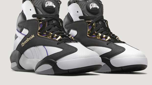 Side view of Shaquille O'Neal's black and white Reebok sneakers.