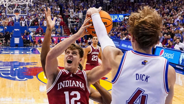 Indiana Hoosiers forward Miller Kopp (12) has his shot blocked by Kansas Jayhawks guard Gradey Dick (4) during the second half at Allen Fieldhouse.