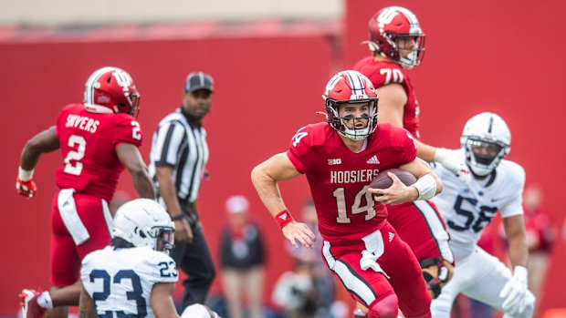 Indiana's Jack Tuttle (14) runs during the first half of the Indiana versus Penn State football game at Memorial Stadium on Satruday, Nov. 5, 2022.
