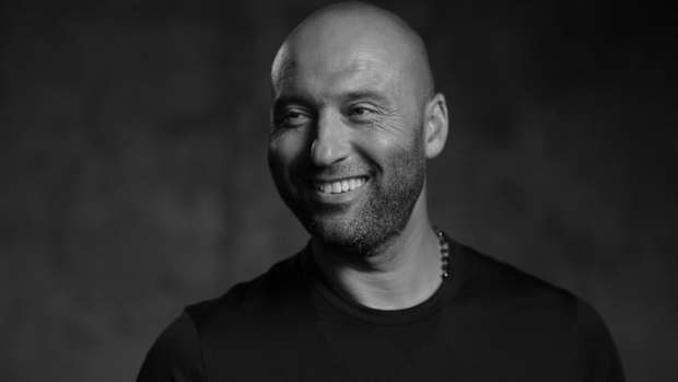Derek Jeter smiles in photo shoot.