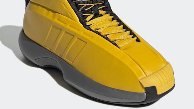 Yellow and black Adidas Kobe shoe.
