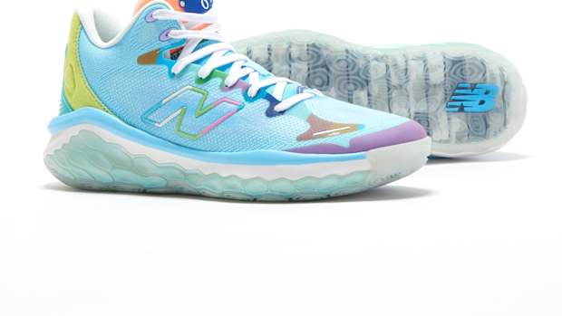View of blue and white New Balance shoes.