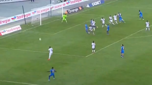 Arthur Masuaku pictured (bottom) moments after shooting from a wide free-kick that resulted in an amazing goal for DR Congo against Guinea at the 2023 Africa Cup of Nations