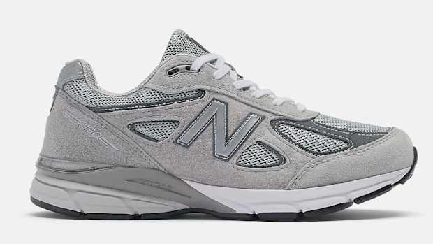 Side view of a grey New Balance shoe.