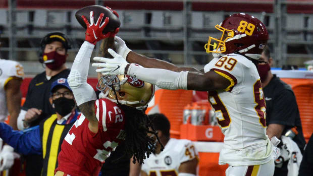 9ers cornerback Jason Verrett intercepts a pass intended for Washington Football Team wide receiver Cam Sims during the first half at State Farm Stadium.