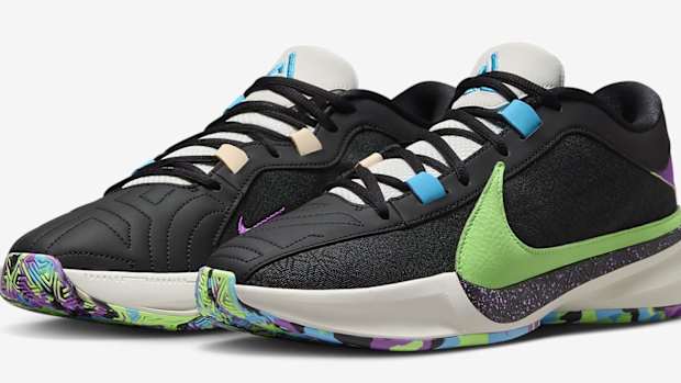Side view of Giannis Antetokounmpo's black, green, and blue Nike shoes.