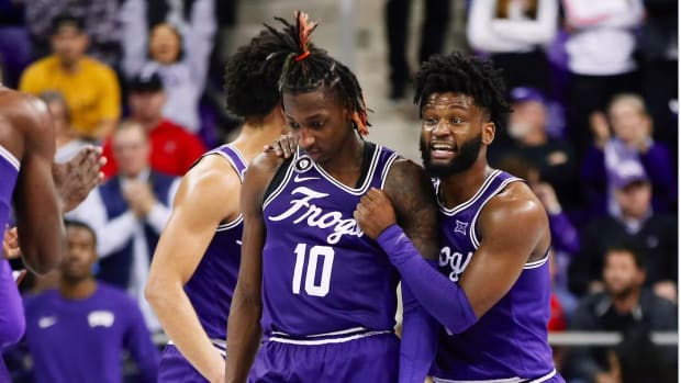 Mike Miles and Damion Baugh playing in a TCU basketball game.