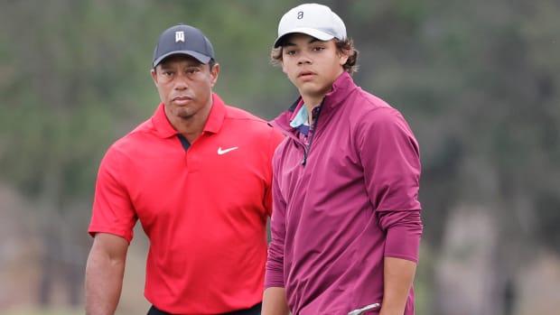 Tiger Woods and Charlie Woods on the green at the PNC Championship.
