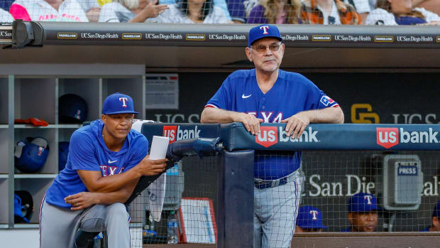 Jul 29, 2023; San Diego, California, USA; Texas Rangers manager Bruce Bochy (15) and associate manager Will Venable (83) watch on as San Diego Padres starting pitcher Yu Darvish (11) pitches during the fifth inning against the San Diego Padres at Petco Park.